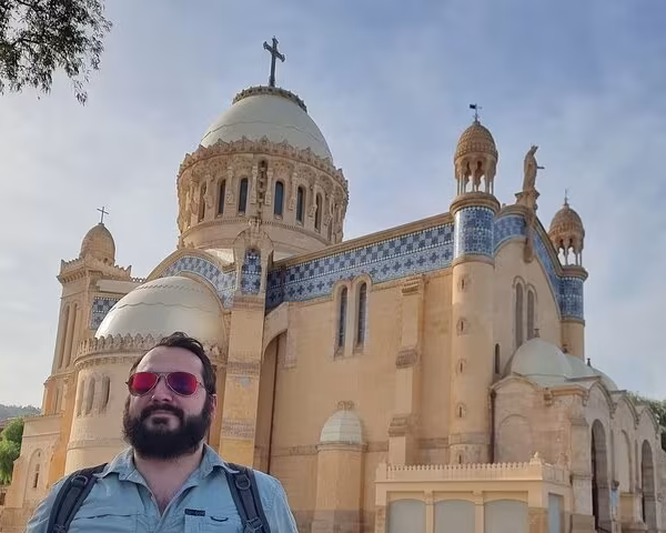 tourist taking pictures and souvenirs of him and the cathedral