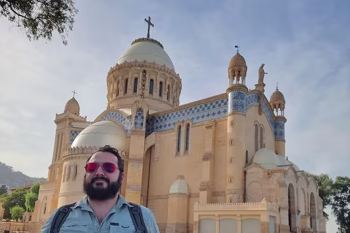 tourist taking pictures and souvenirs of him and the cathedral